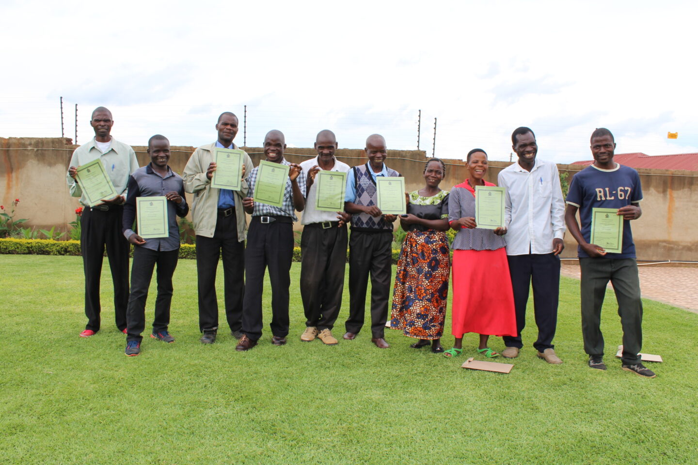 Farmers show certificates they received to become a cooperative in Malawi