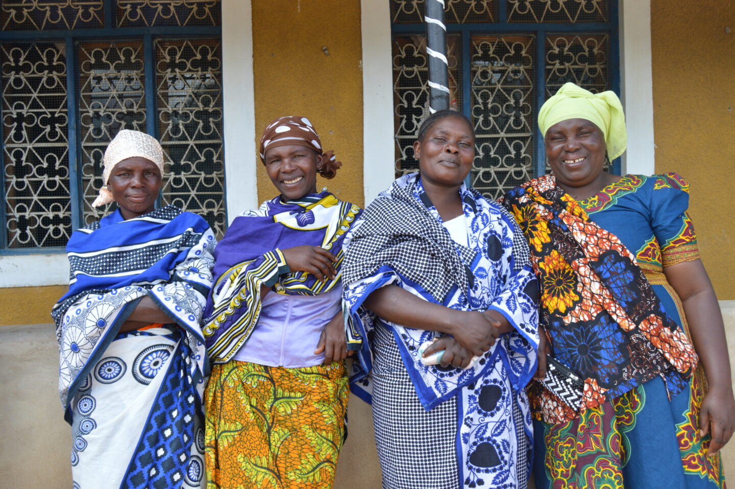 A group of women stand outside a meeting house in Tanzania