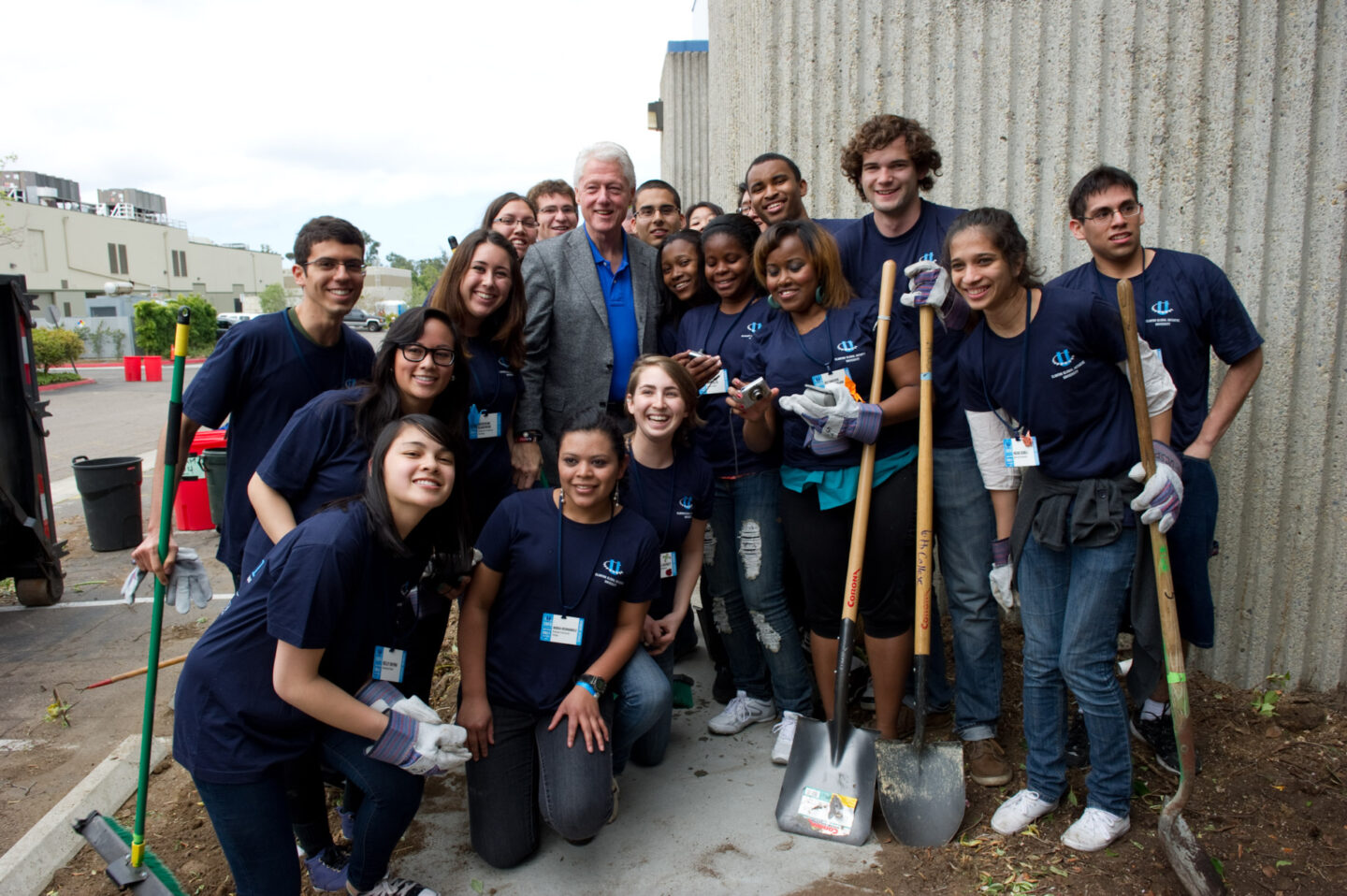 President Clinton takes a photo with student volunteers in San Diego