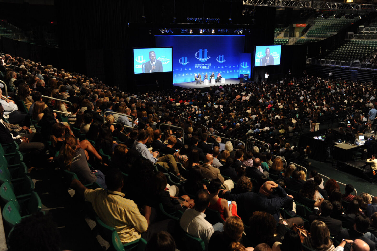 Students and guests watch a plenary session at the University of Miami