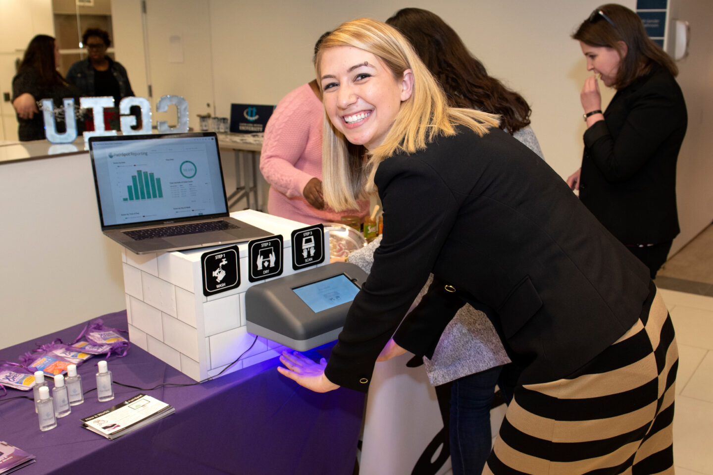 Christine Schindler, CGI U alumna and founder of PathSpot, demonstrates how to use her technology