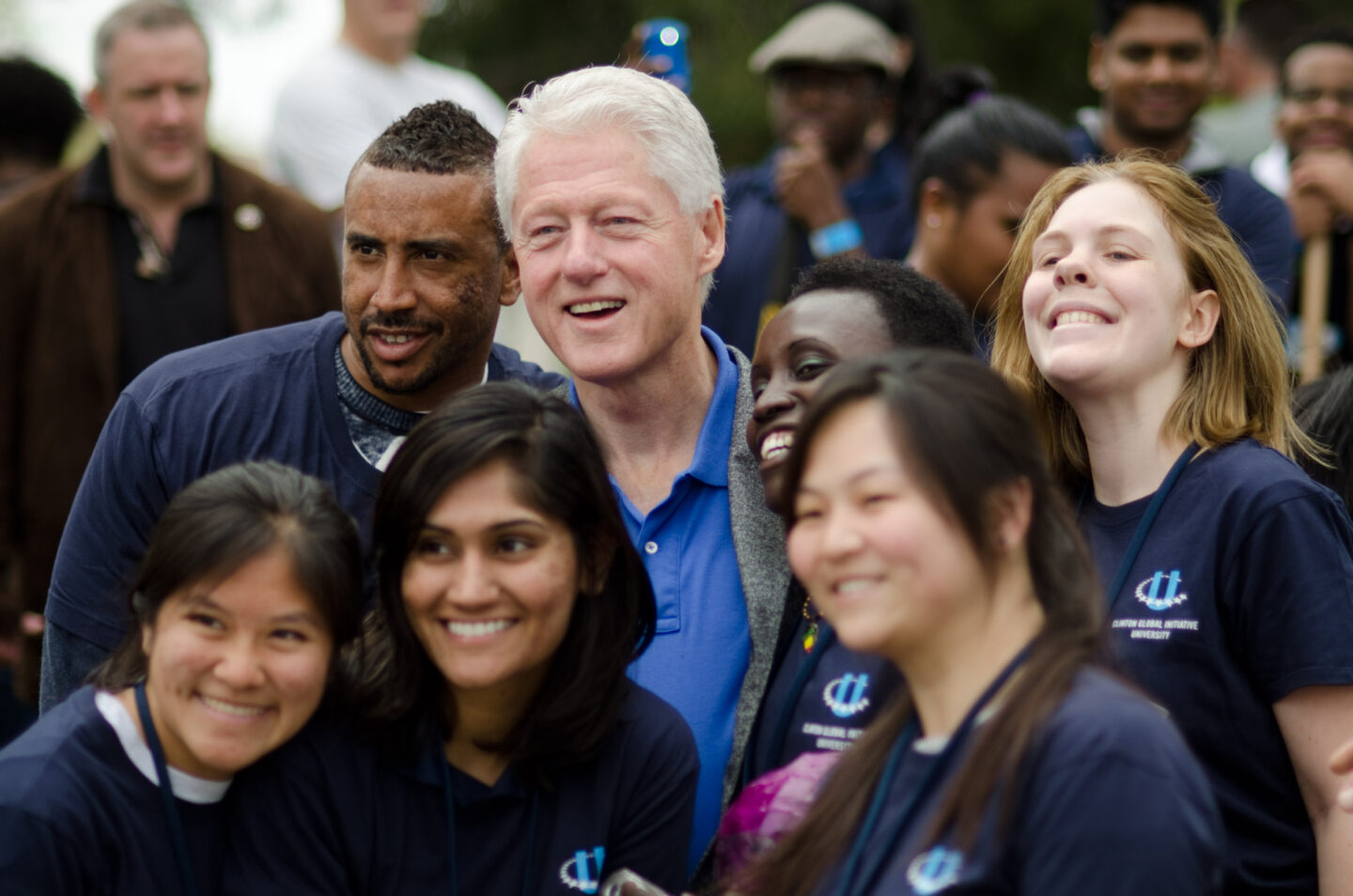 President Clinton takes a photo with student volunteers at a Day of Action in San Diego