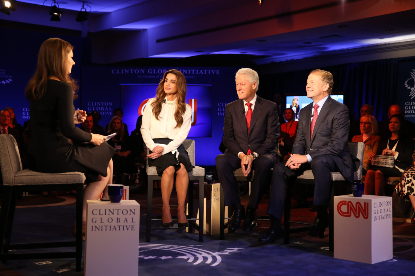 Queen Rania Al Abdullah, President Bill Clinton, and Tony Blair participate in a special session