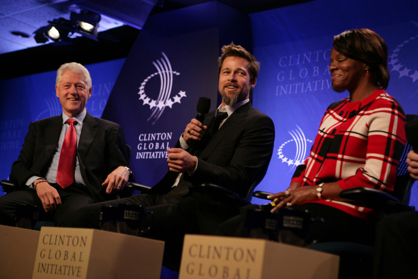 President Bill Clinton, Brad Pitt, and Deirdre Taylor participate in a special session