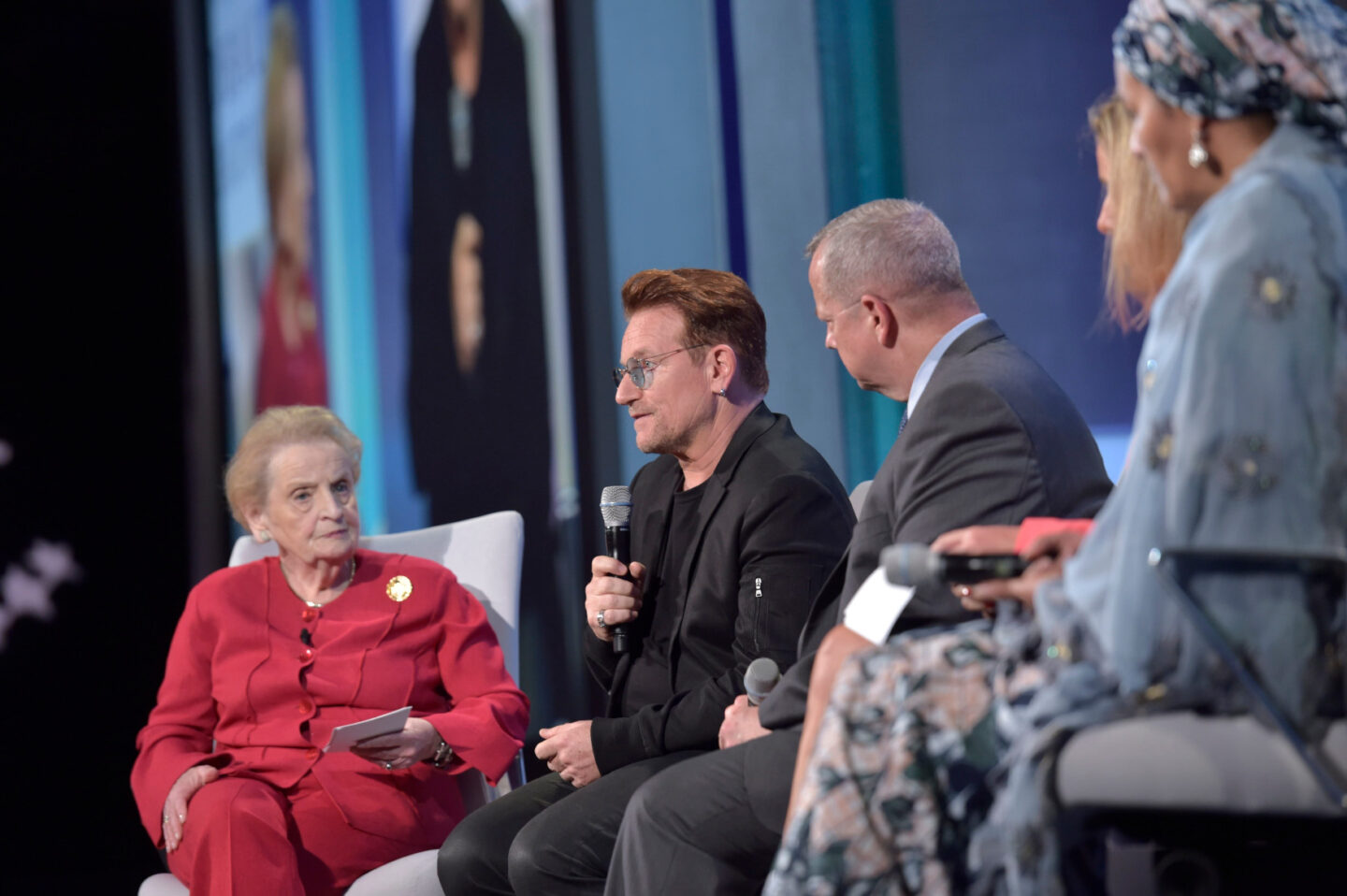 Bono speaks on stage during a plenary session