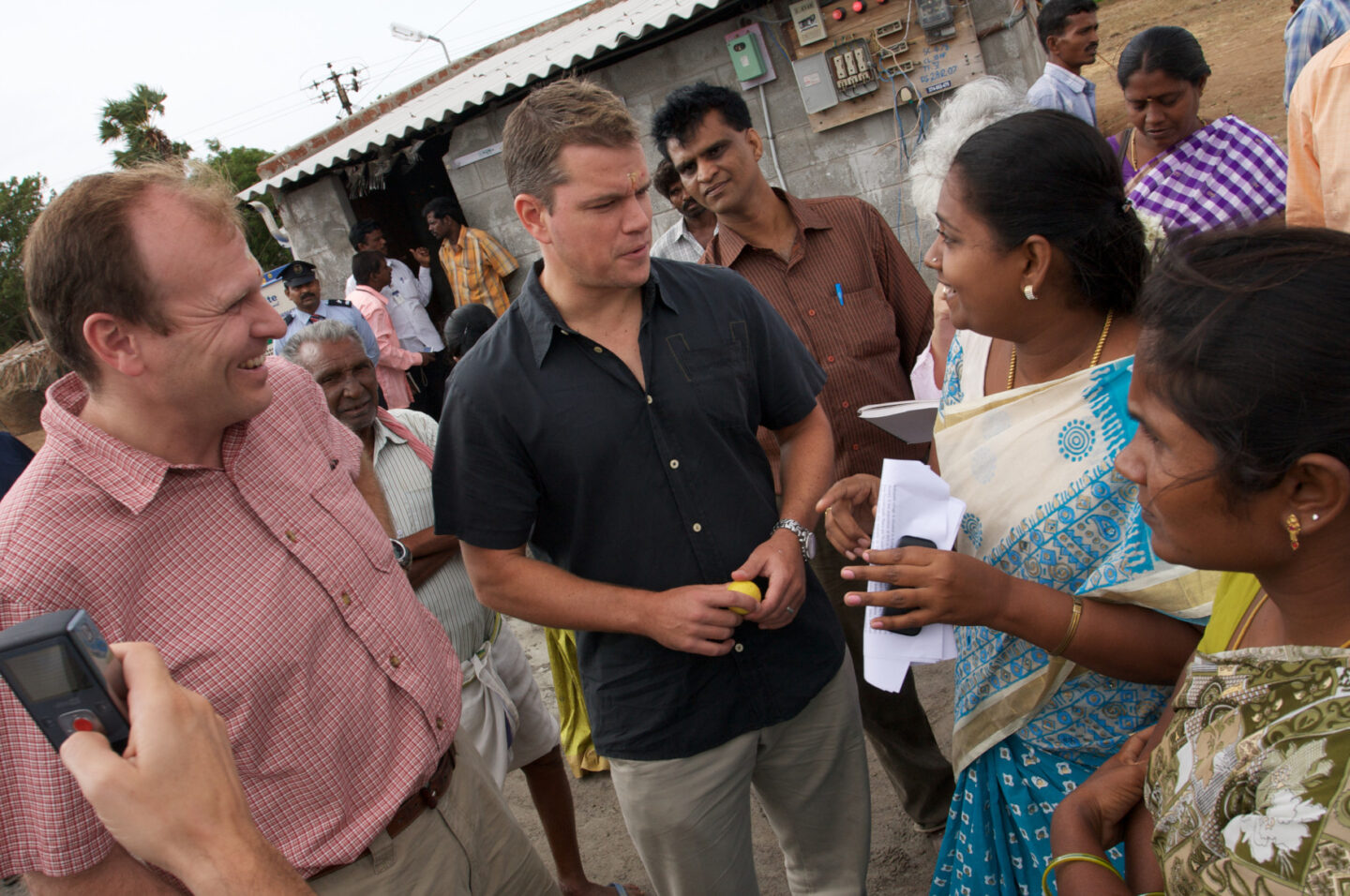 Matt Damon and Gary White visit a village in India