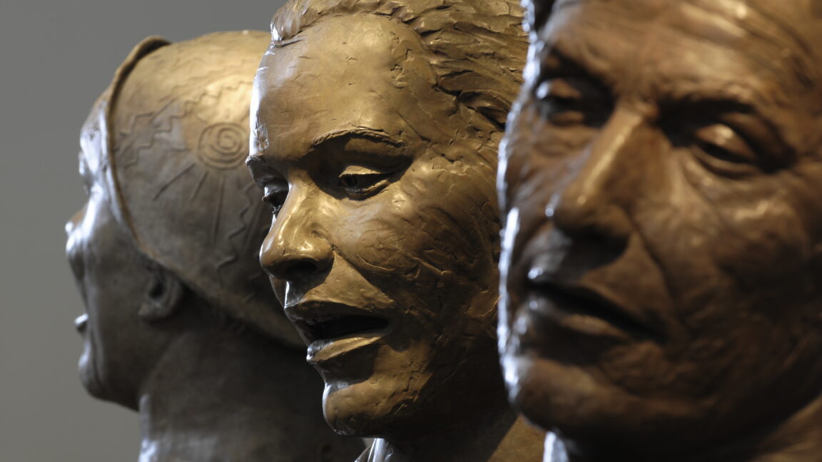 Close-up of sculptures of faces