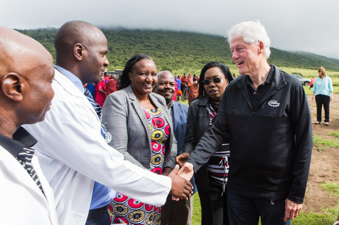 President Clinton shakes hands with medical professionals in Ngorongoro, Tanzania