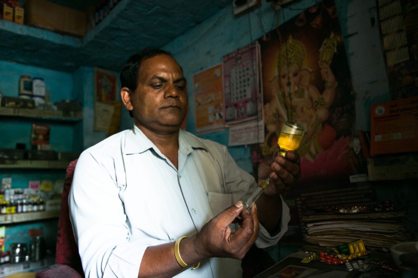 An individual holds up a medical device in Uttar Pradesh, India