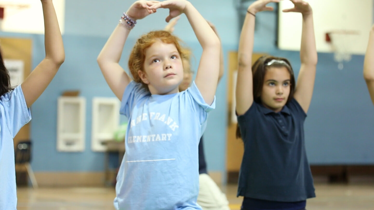 A student practices yoga at an elementary school in Pennsylvania