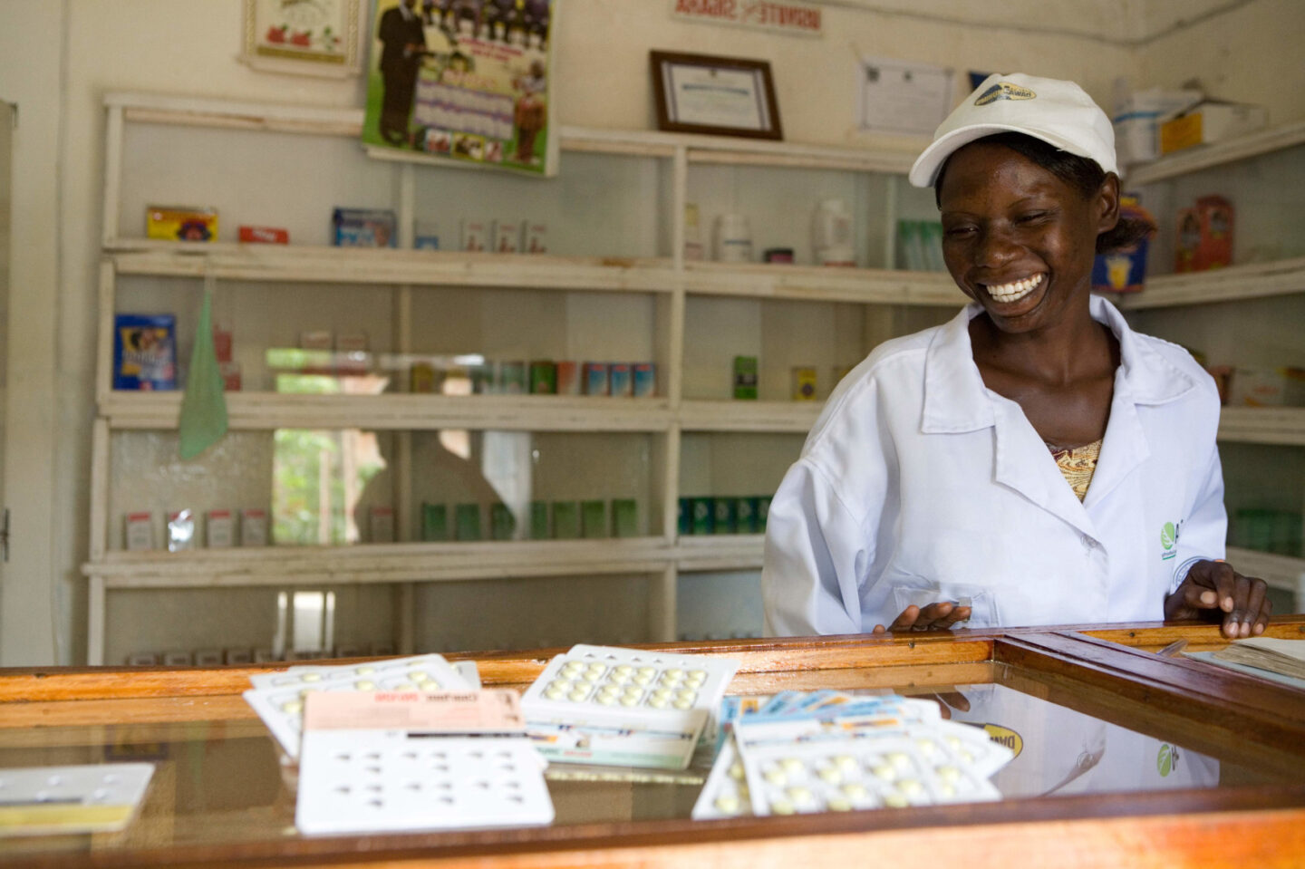 An individual stands in front of medical supplies in Zambia