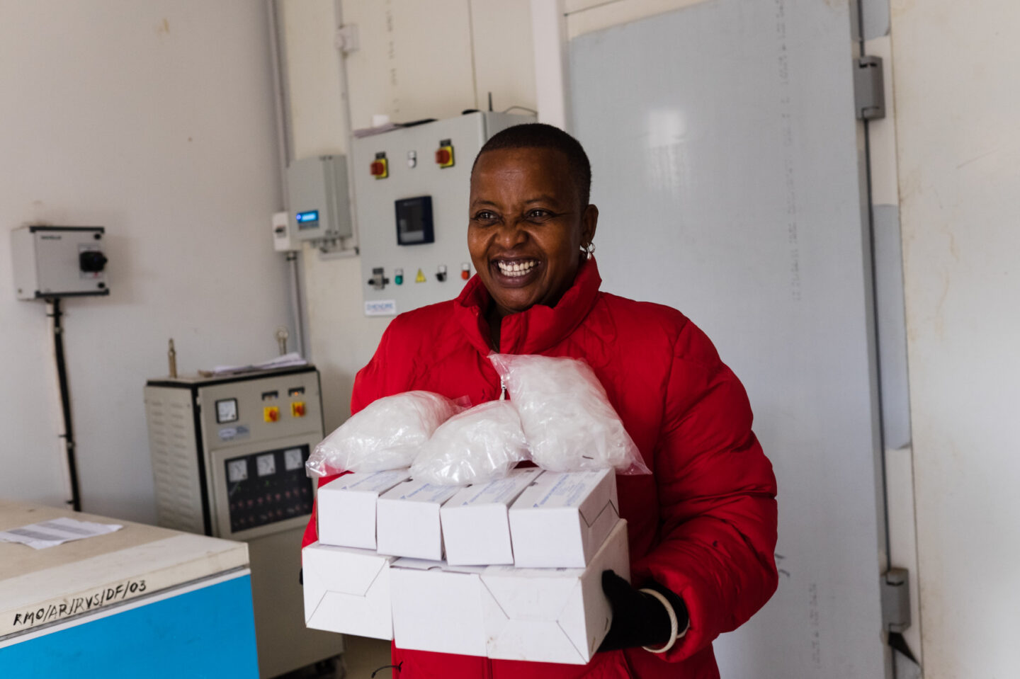 An individual holds boxes with medical supplies in Dar es Salaam, Tanzania