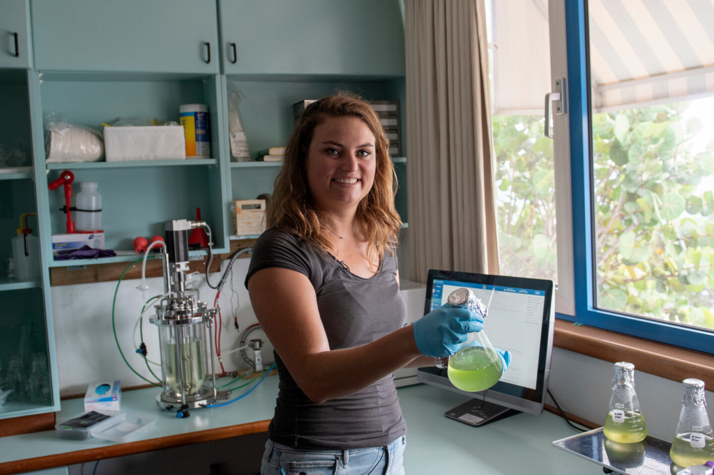 A woman works in her lab in Curaçao