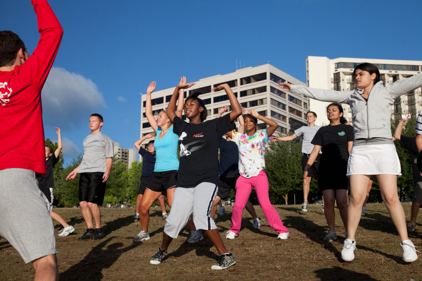Students jumping during an outdoor physical activity