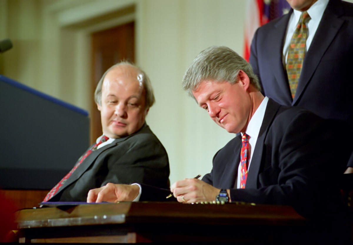 President Bill Clinton signs the Brady Bill while Jim Brady looks on