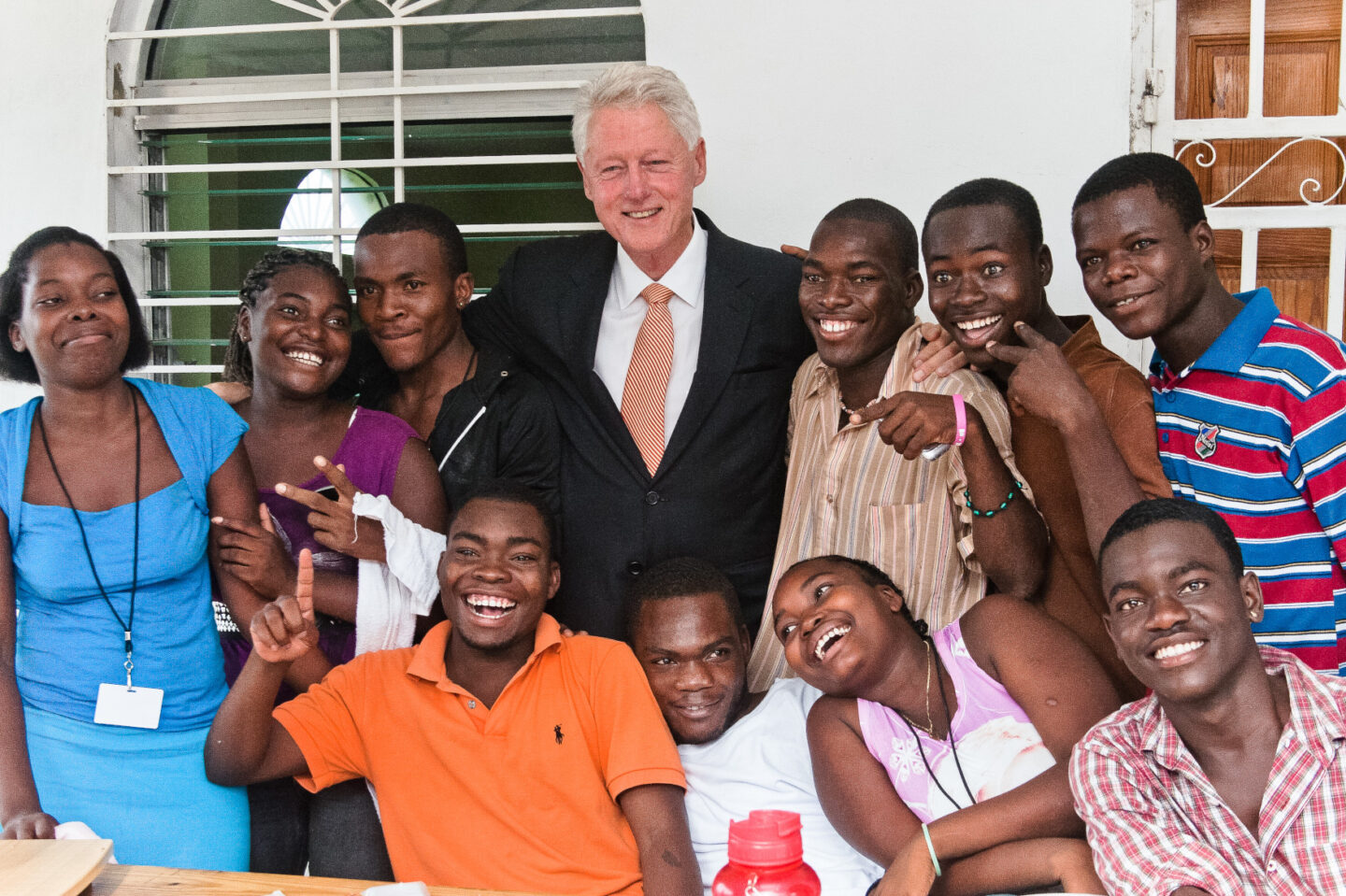 President Clinton stands with a group of individuals