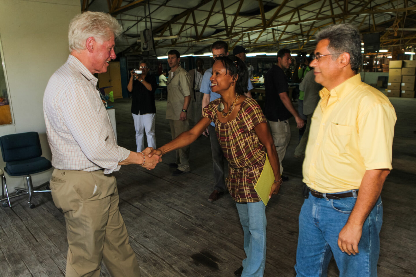 President Clinton shakes an individual's hand