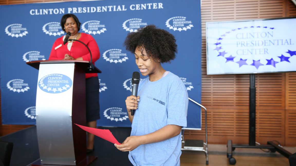 Student speaks into a microphone during a high school student leaders program