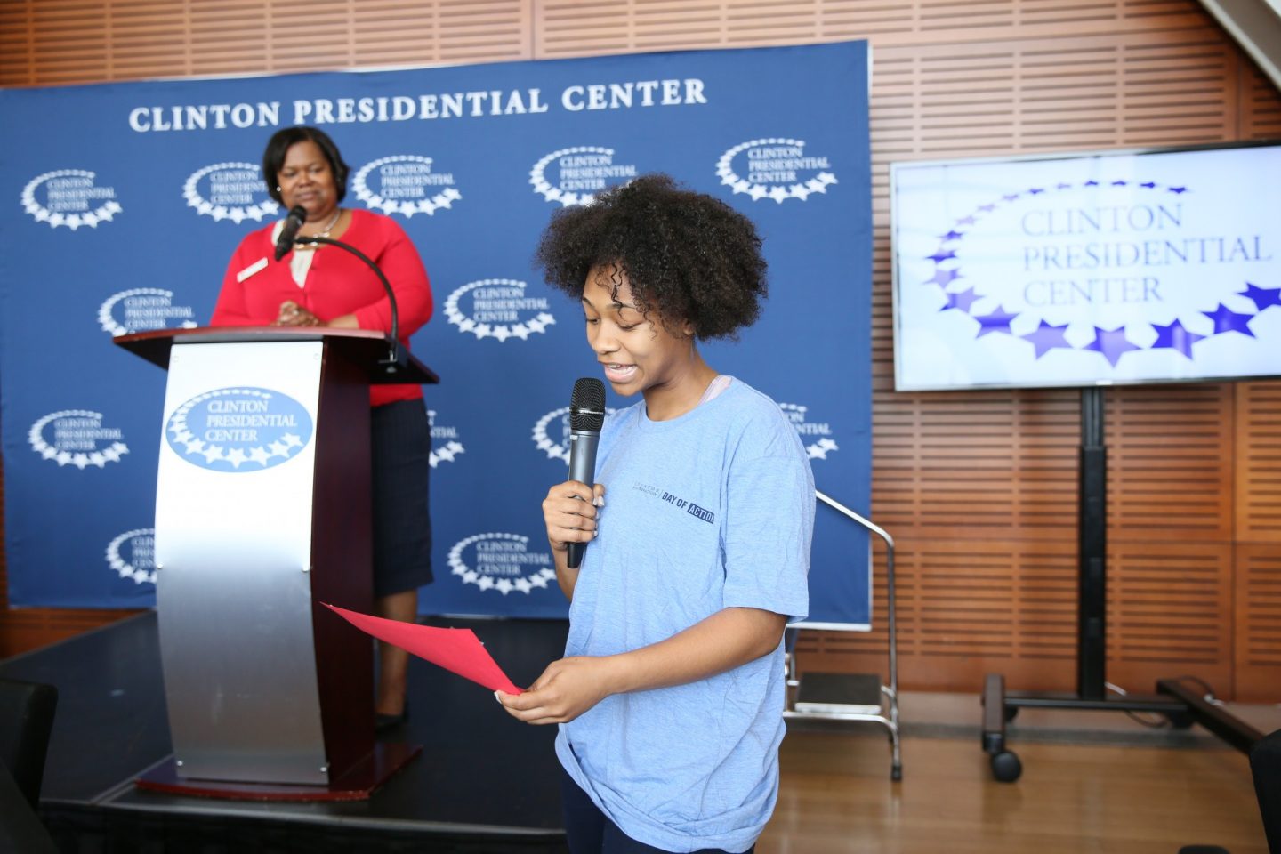 Student speaks into a microphone during a high school student leaders program