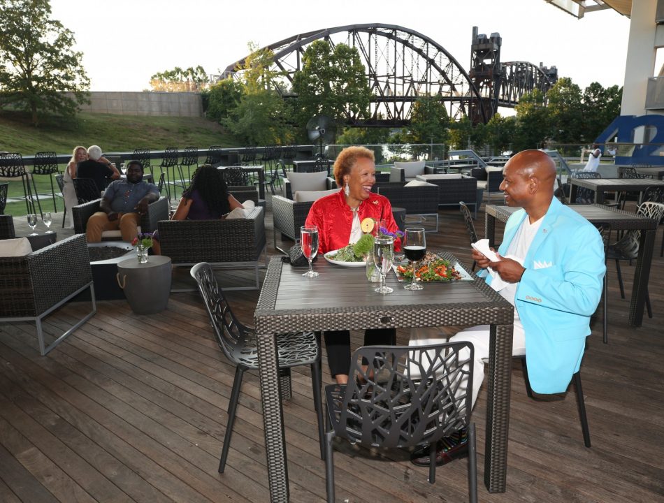Diners enjoying a meal on the 42 bar and table patio