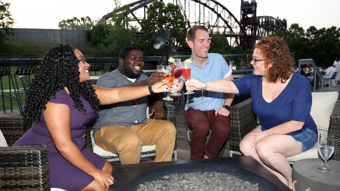 A group enjoying drinks on the 42 bar and table patio