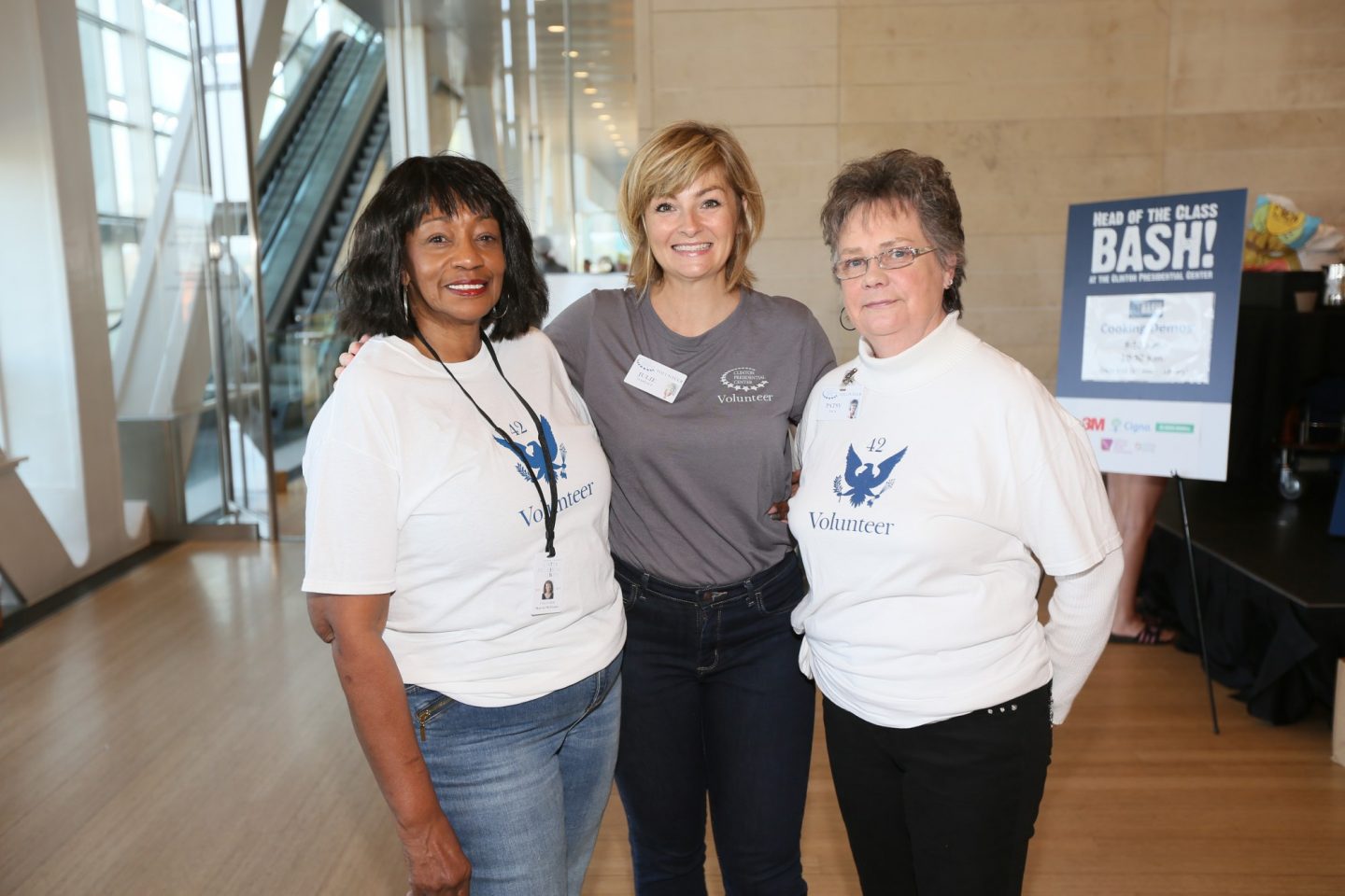 Three Clinton Center volunteers serving at the Head of the Class Bash