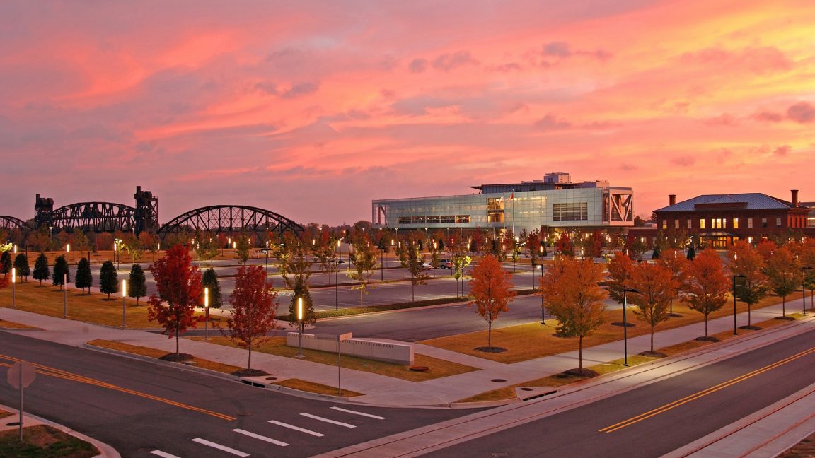 An exterior shot of the Clinton Presidential Center at sunset