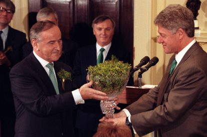 President Clinton is handed a bowl of shamrocks