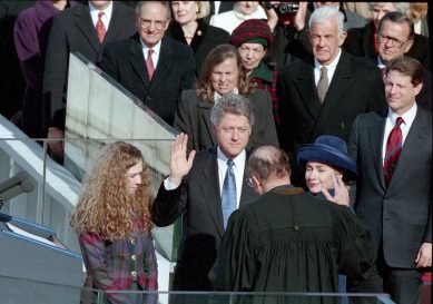 President Clinton raises his right hand while taking the oath of office in front of the United States Capitol