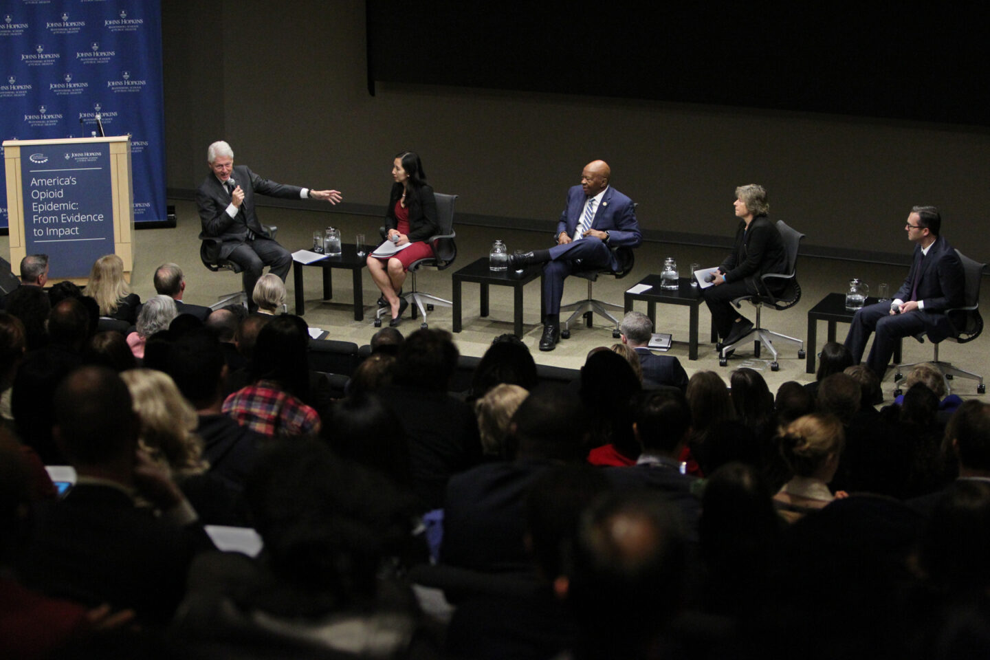 President Clinton speaks onstage with a panel