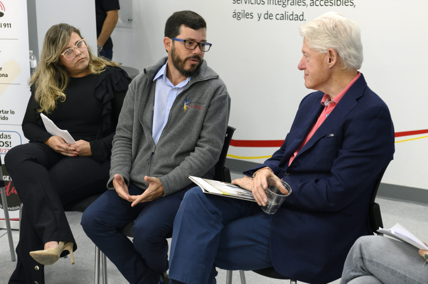 President Clinton speaks with an individual