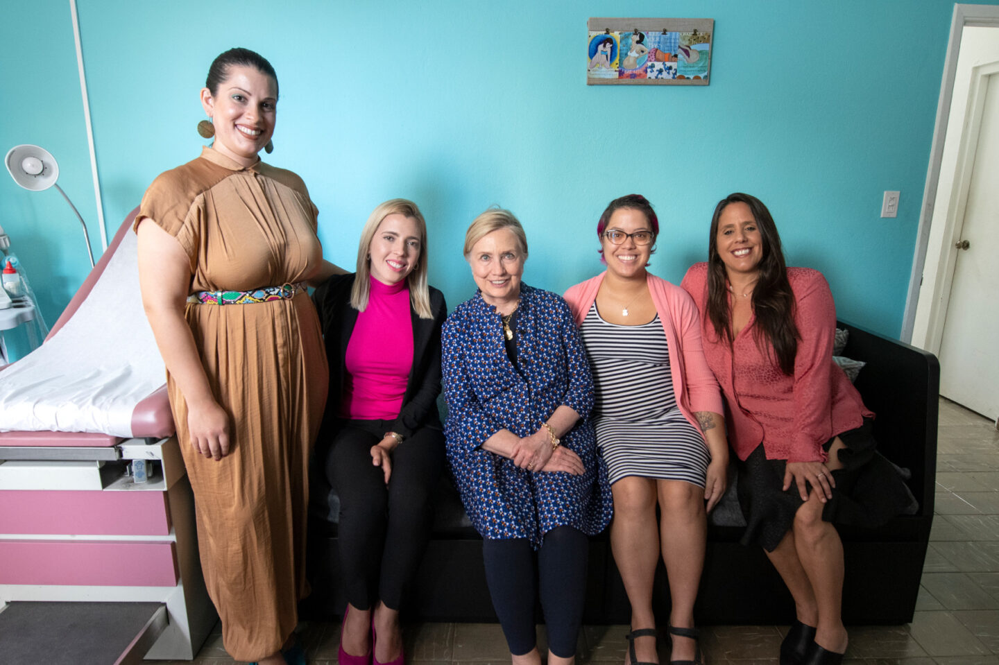 Secretary Clinton takes a photo with midwives and a new mother at a maternal community center in Puerto Rico
