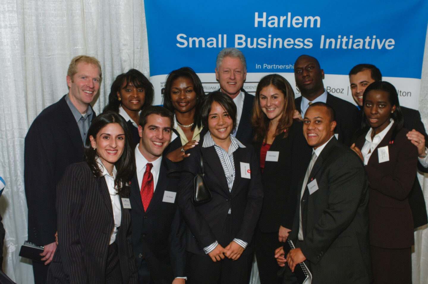 President Clinton takes a photo with members of the Harlem Small Business Initiative in New York