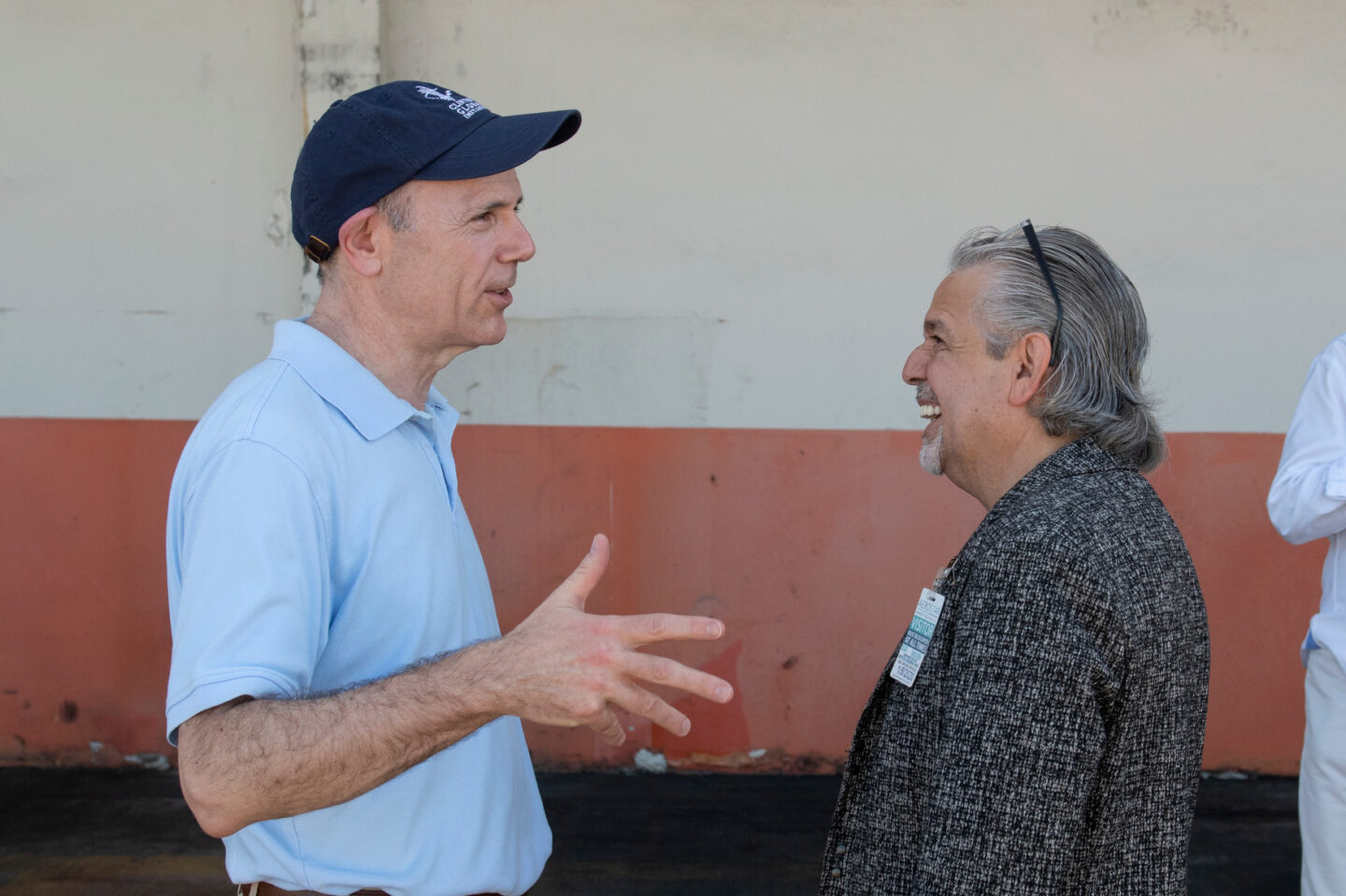 Clinton Foundation CEO Kevin Thurm speaks to Luis A. Miranda, Jr. in Puerto Rico