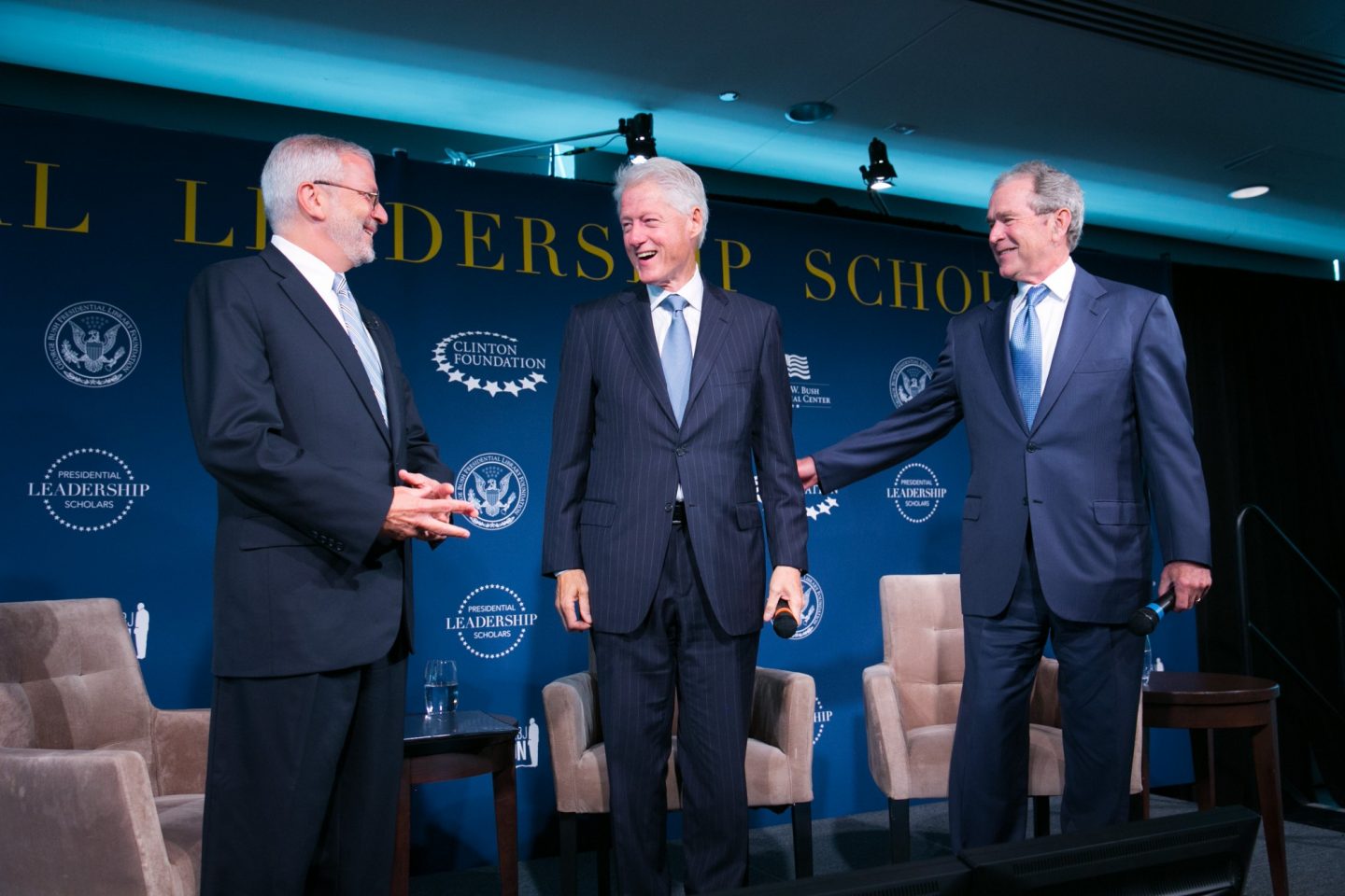 President Clinton and President George W. Bush stand onstage together