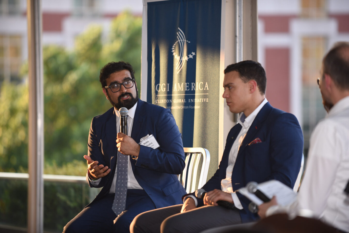 Rohit Malhotra speaks at a dinner event
