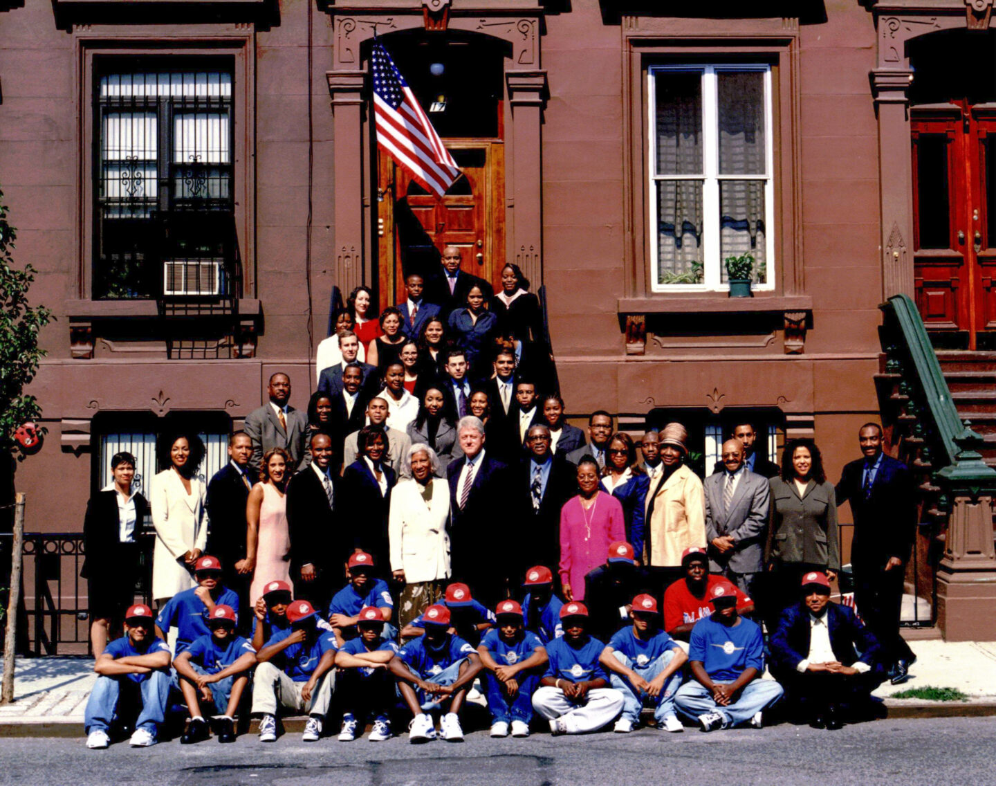 President Clinton takes a photo with members of the Harlem Small Business Initiative in New York