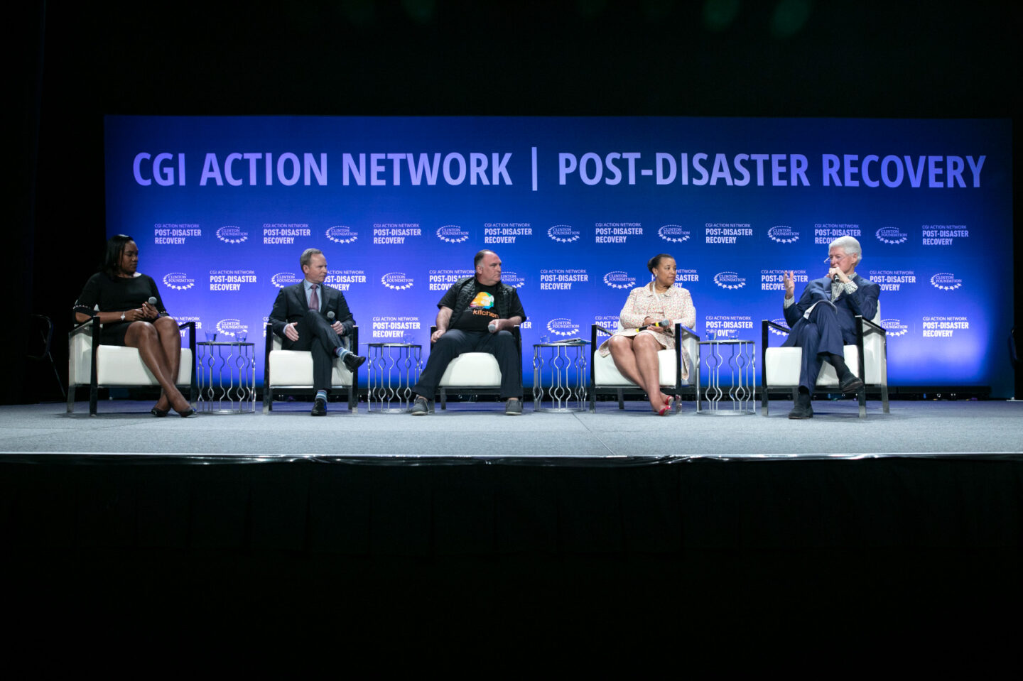 President Clinton moderates a panel discussion in Puerto Rico