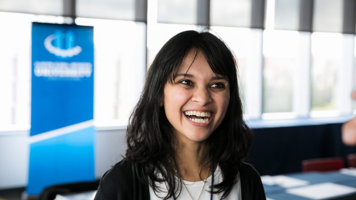 Smiling individual during a CGI U event