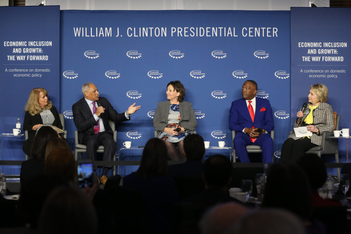 Secretary Clinton and others participate in a panel discussion