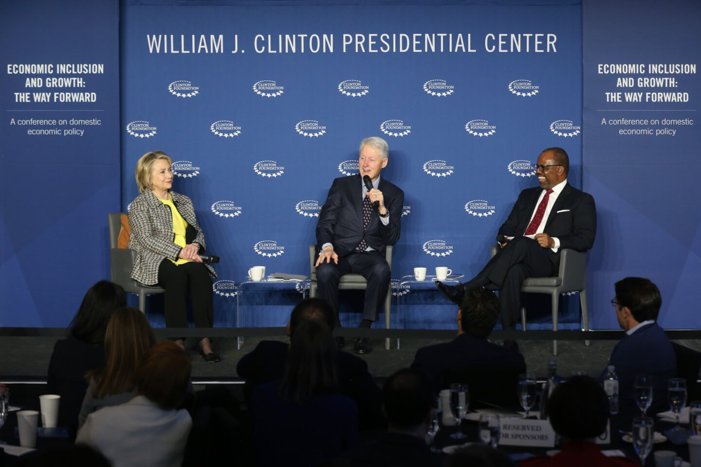 Secretary Clinton and President Clinton participate in a panel discussion