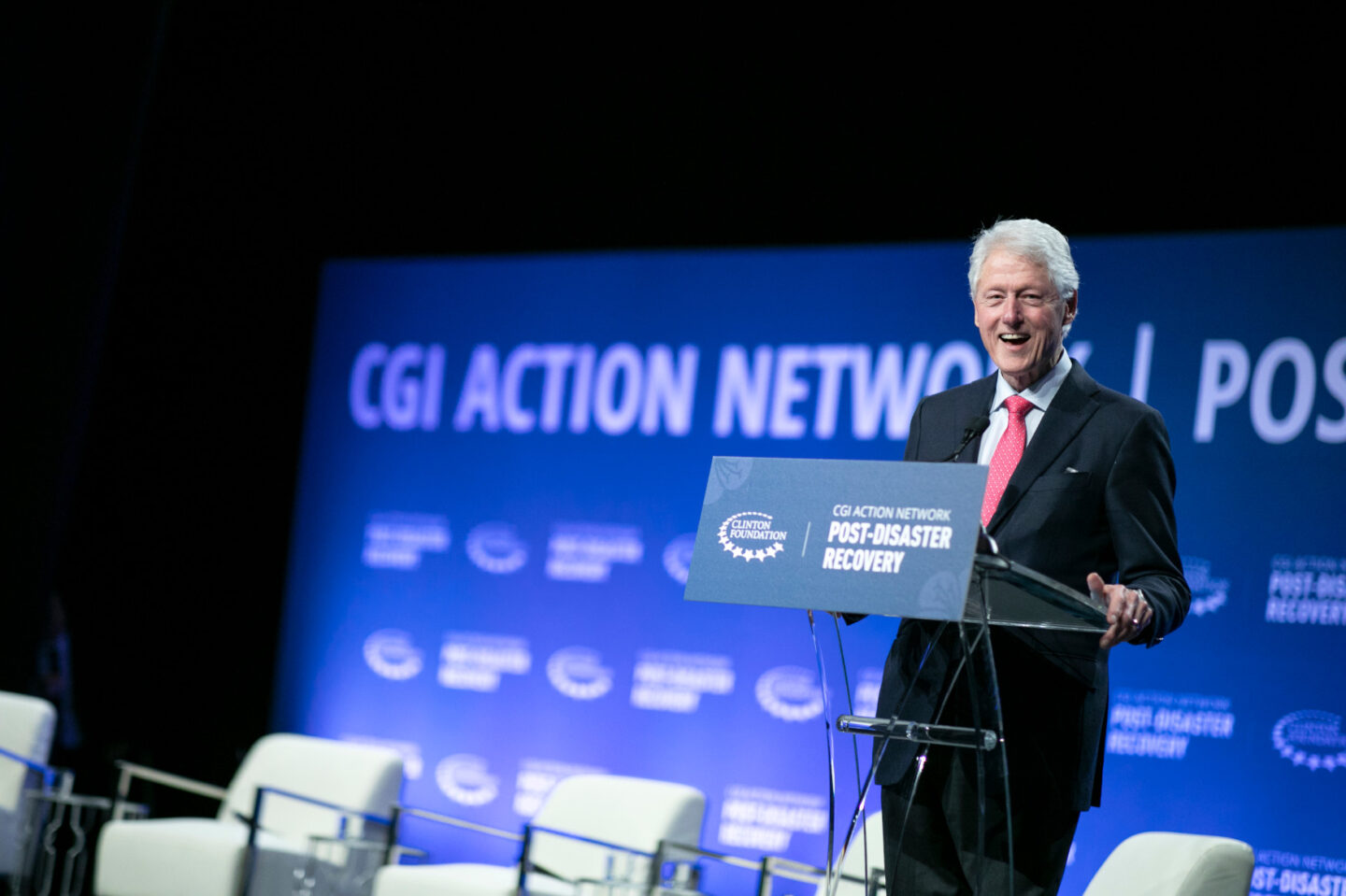 President Clinton speaks on stage during a plenary session
