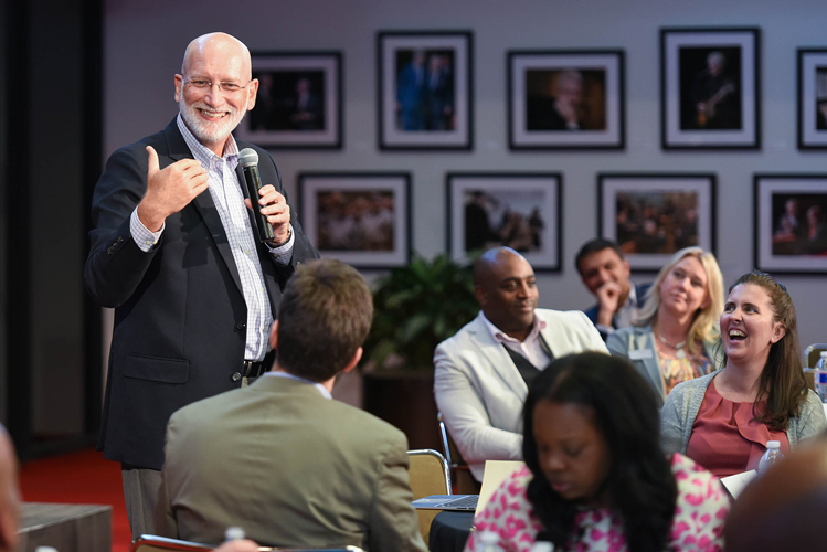Dr. Mike Hemphill speaks into a microphone