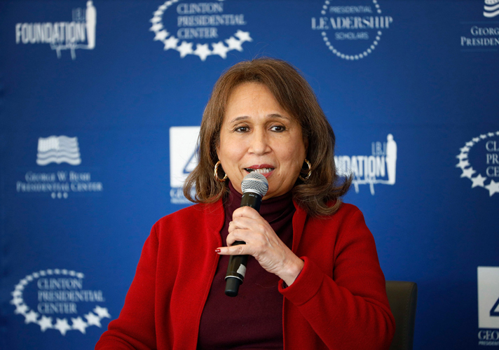 Secretary Alexis Herman speaks into a microphone