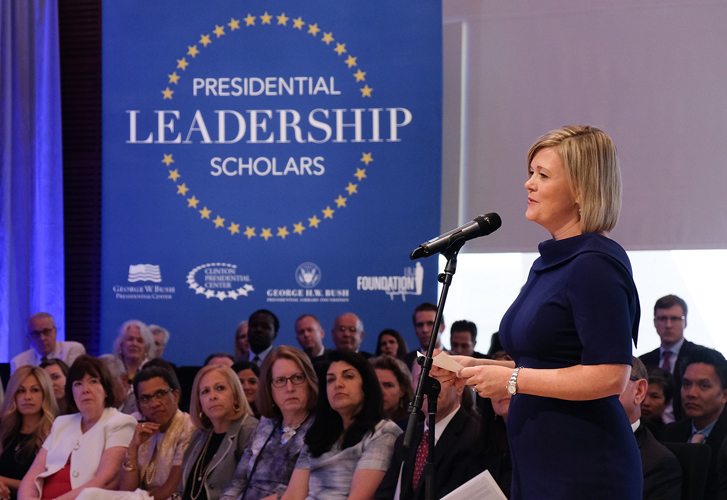 An individual speaks into a microphone