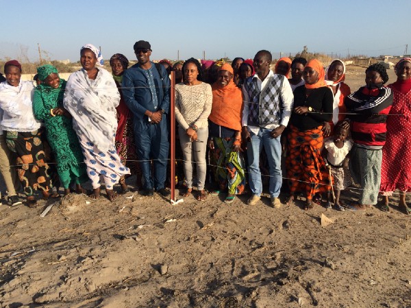Individuals take a group photo in Senegal