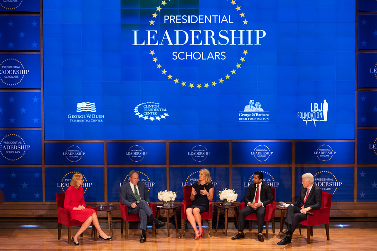 Panel seated on stage