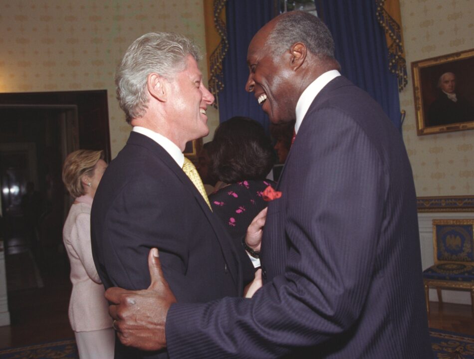 President Clinton and Vernon Jordan speak with one another