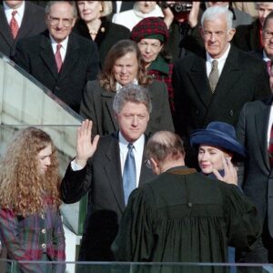 President Clinton taking the Oath of Office with Chelsea Clinton and Hillary Clinton standing nearby.