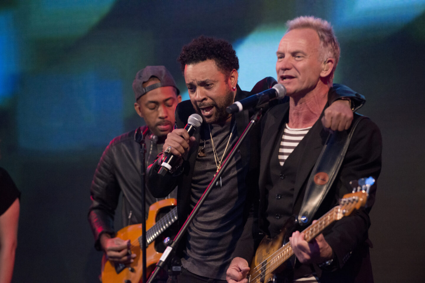 Musicians Sting and Shaggy sing onstage together